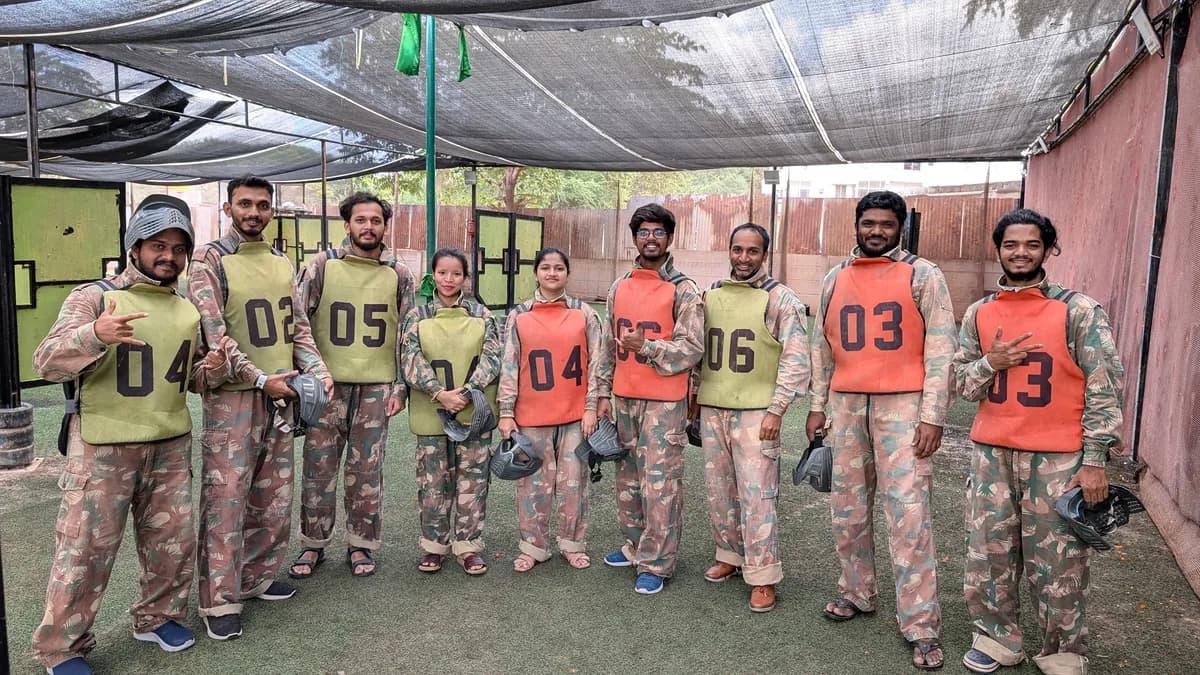 The Creo team lined up in gear for a paintball match