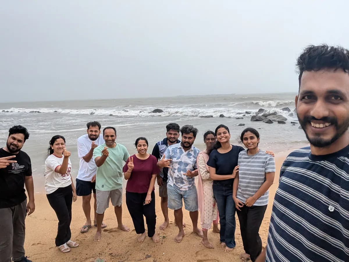 Creo teammates together on the beach at sunset