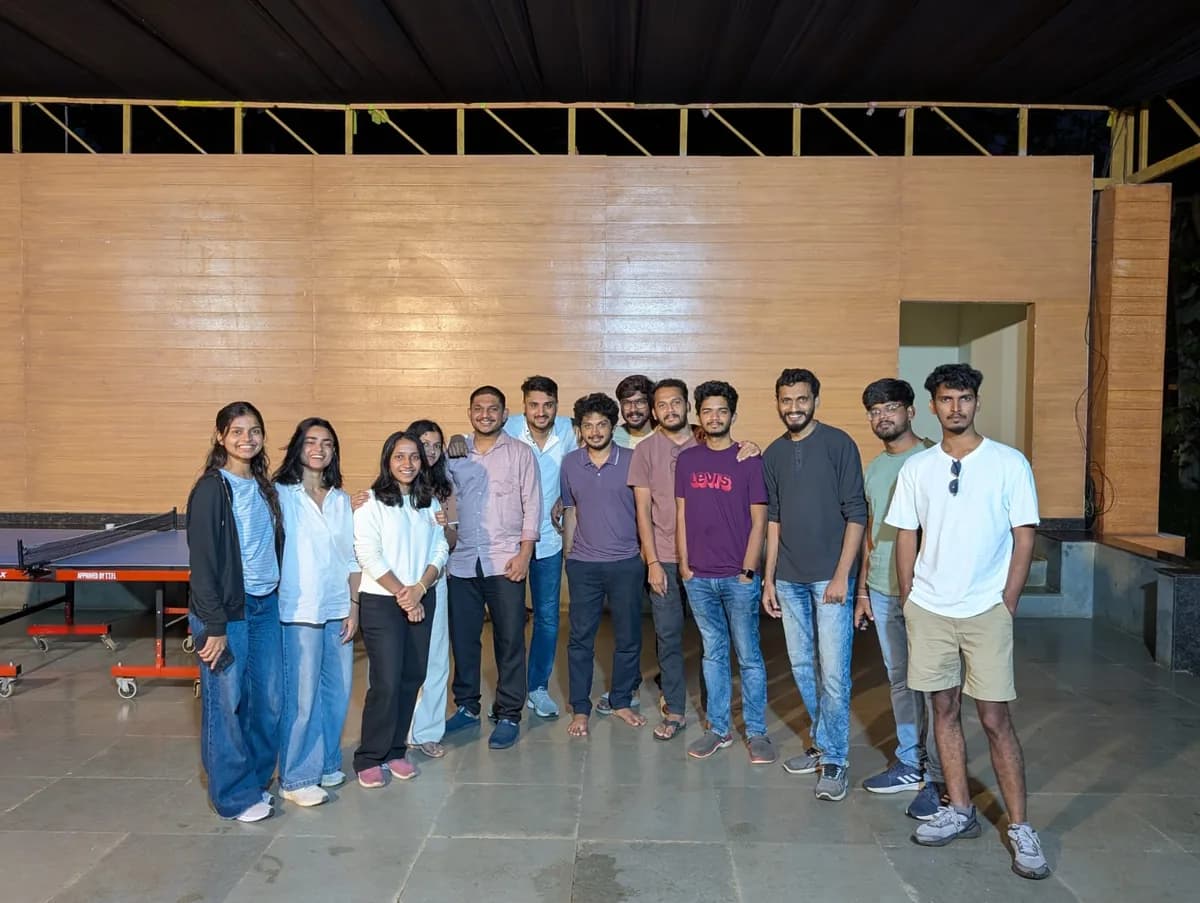 Creo teammates gathered around a table-tennis game