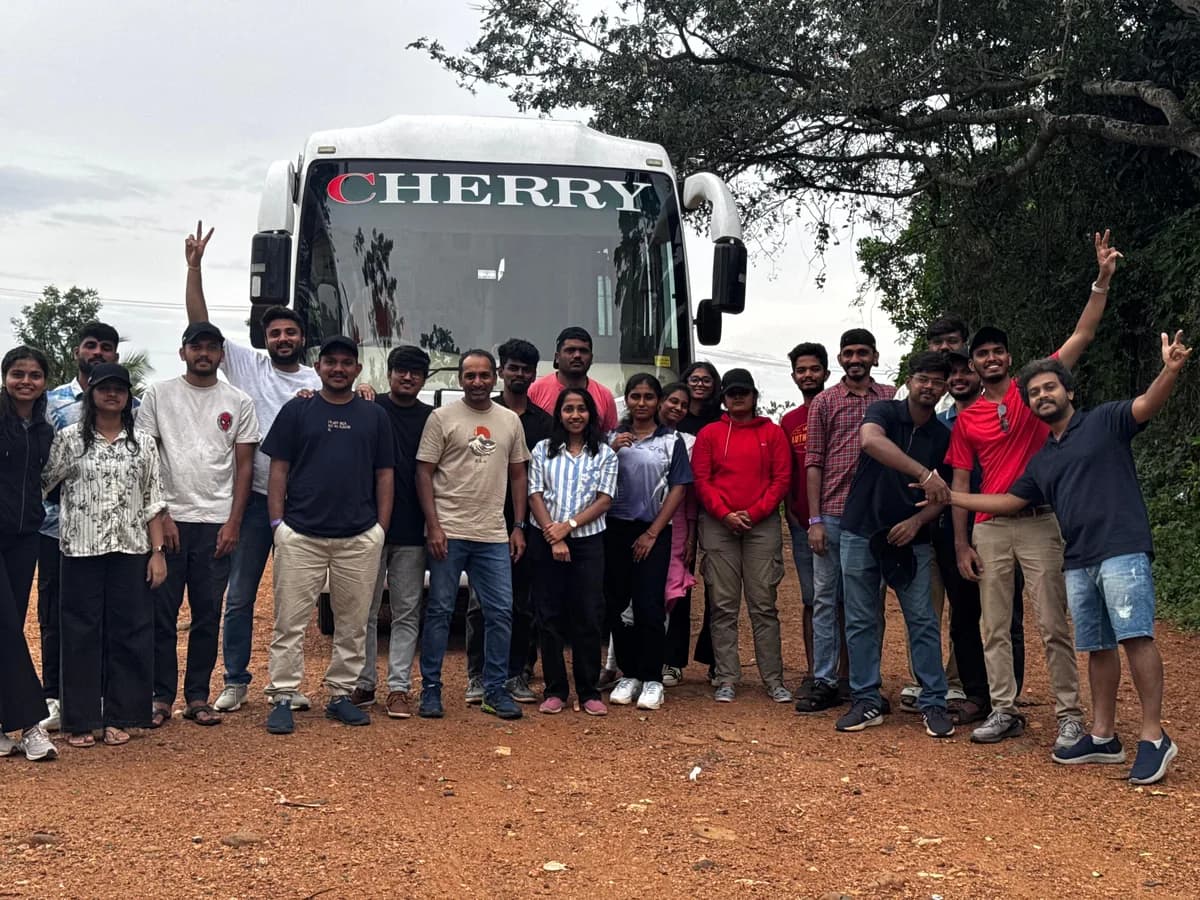 The Creo team on a road trip, gathered beside the coach