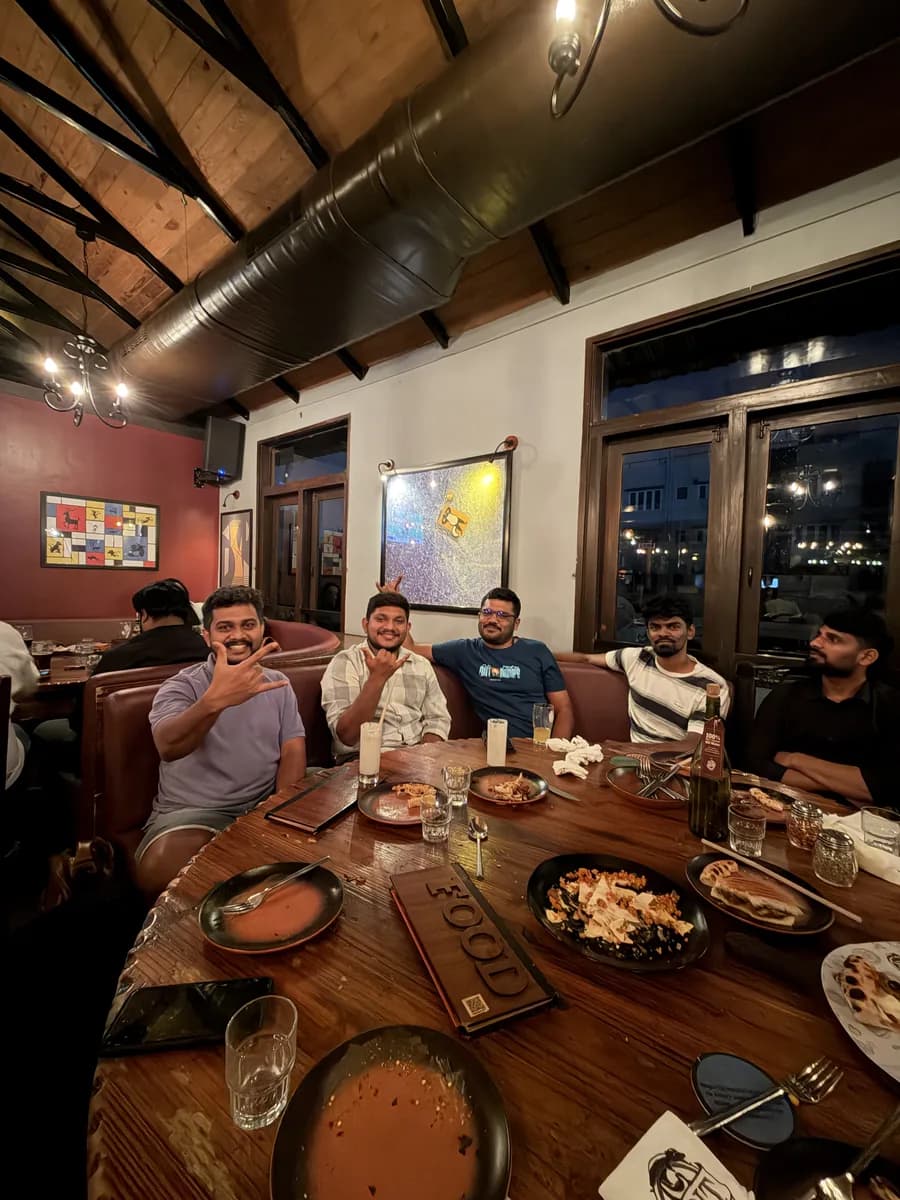 Creo teammates sharing a warm dinner around a table