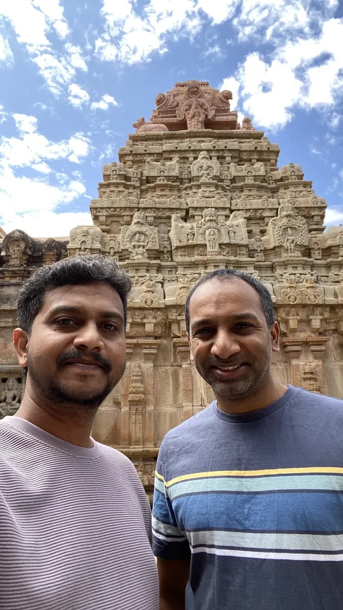 Two Creo teammates visiting a historic carved temple